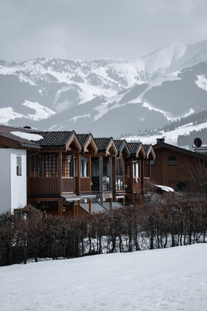A beautiful view of wooden cabins on a cold winter day
