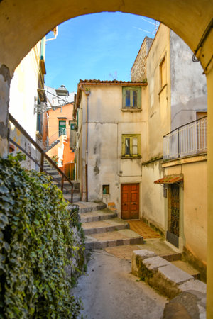 A narrow street among the old houses of a medieval town in the province of Salerno, in the Campania region.の写真素材
