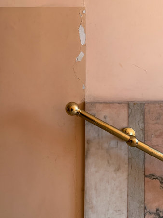 A closeup of a handrail on a wallの写真素材