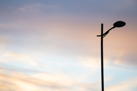 Beautiful sunset sky and a street light.の写真素材