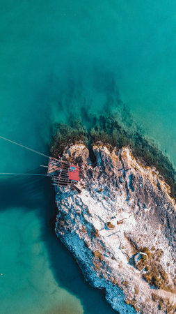 A beautiful high angle view of rocky cliffs on the water on the Beach of Architiello of San Felice, Italyの写真素材