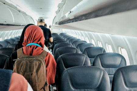 A people take their seats before the plane takes offの写真素材