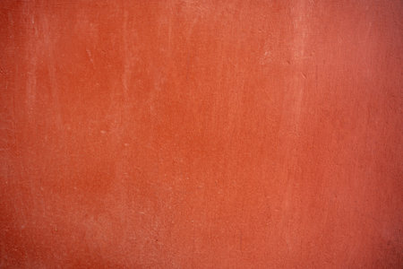 A closeup of a terracotta color backgroundの写真素材