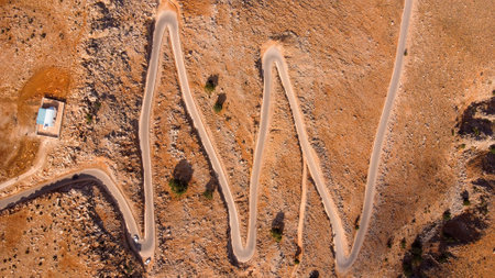 Mountainous, serpentine road leading to Balos in the Crete, Greeceの写真素材
