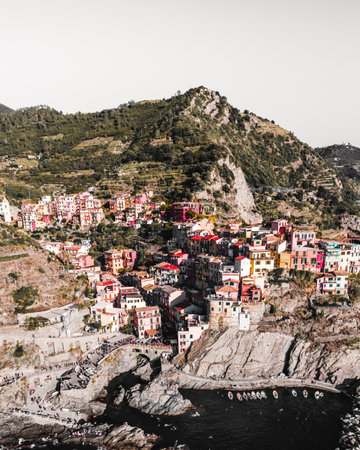 A vertical shot of a coastal town with colorful houses