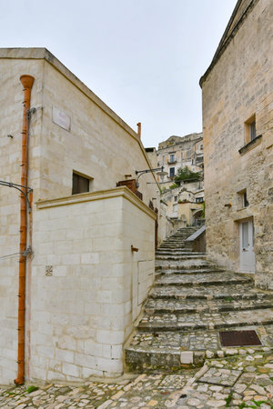 A small street between the old houses of an ancient city in the Basilicata region.の写真素材