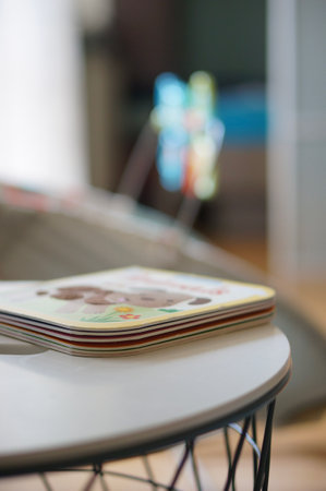 A closeup of a child book on a table on a blurred background