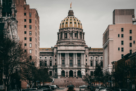 A closeup of an old beautiful building with a cloudy sky backgroundの写真素材