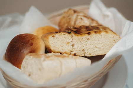 A basket with various types of breadの写真素材