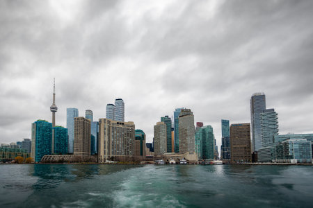 A monochrome cityscape of a gloomy Toronto, shot from the lake Ontarioの写真素材