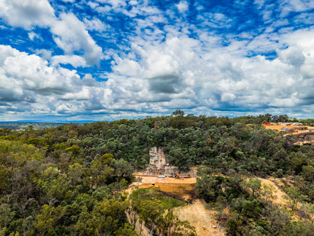 An aerial view at the Ottery Mine against a cloudy blue sky in Tent Hill near Emmaville New South Wales Australiaの写真素材
