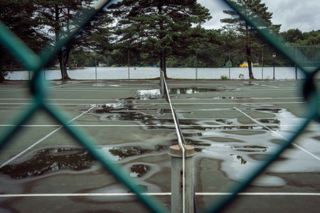 A tennis court after a rainの写真素材