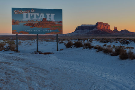 A beautiful view of a snowy field with a rocky mountain in the background