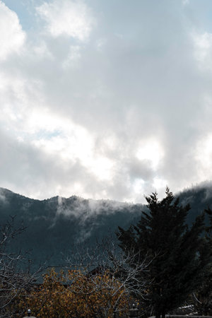 A mesmerizing view of a beautiful mountainous landscape on a misty day