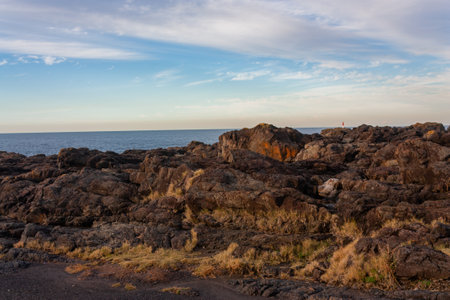 A scenic view of a blue ocean on cloudy sky background in Melbourne, Australiaの写真素材