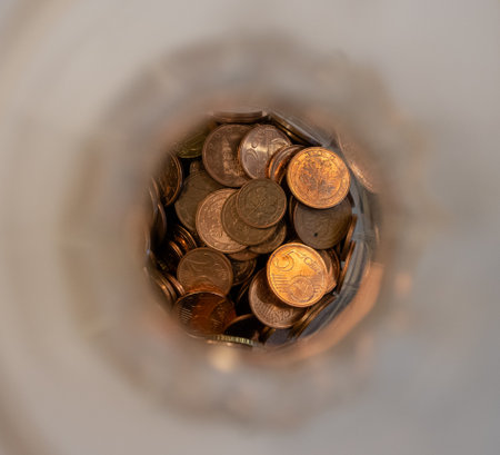 A closeup of a heap of coins. Top view.の写真素材