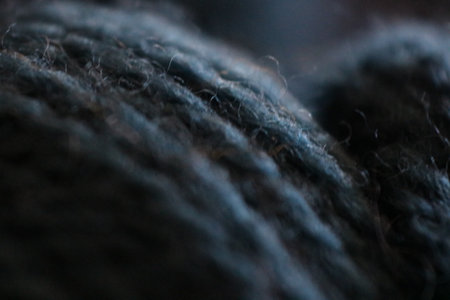 A closeup of a grey yarn fibre material