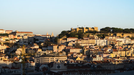 A town on a hill in the sunset..