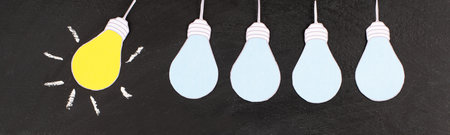 Standing out from the crowd, having a new idea, light bulb concept, be different, leadership