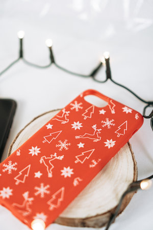 A closeup of Christmas ornaments on a phone caseの写真素材