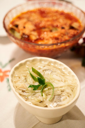 A vertical shot of a festive table with tasty dishes on it.の写真素材
