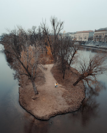 An aerial view of an autumn park on a lakの写真素材