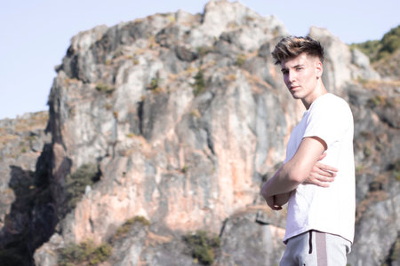 A blonde Spanish young hiker man on the mountainの写真素材