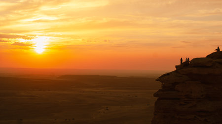 A beautiful shot of a sunset over the Edge of the World in Saudi Arabiaの写真素材