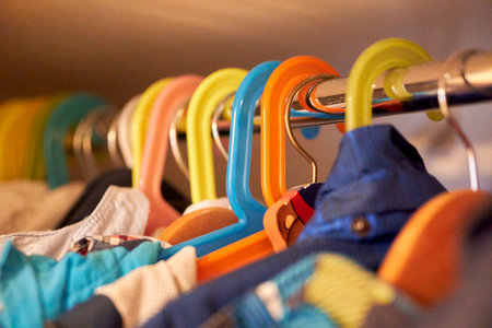 A closeup of colorful clothes hangers