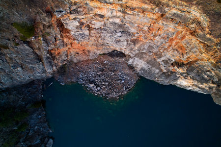 An aerial shot of a huge rock on the waterの写真素材