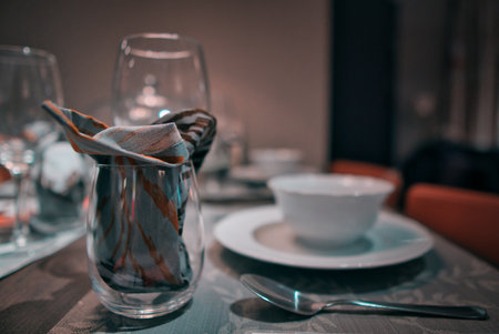 A selective focus shot of tableware on the tableの写真素材