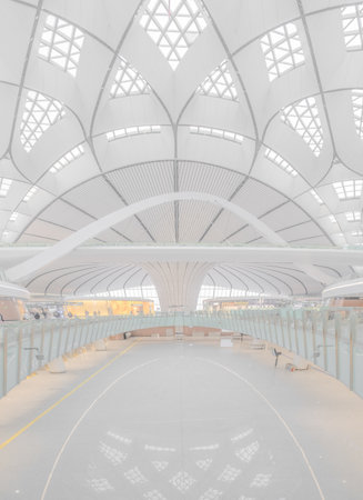 A vertical shot of an interior of Beijing Daxing International Airport, China