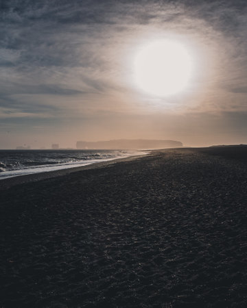 A beautiful landscape of a sandy beach on the sunriseの写真素材