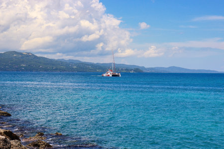 A beautiful view of a ship in a sea under the blue skyの写真素材