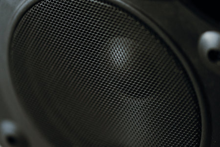 A closeup shot of a black speaker in a studio