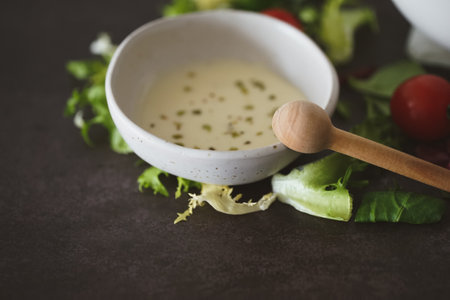 A closeup shot of a salad dressing in a white bowlの写真素材