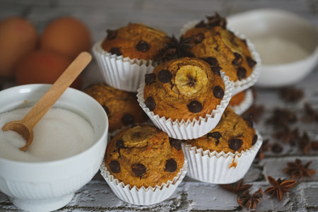 A closeup shot of some muffins on the wooden background