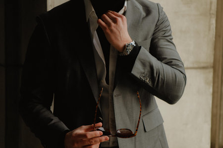 A handsome fashionable gentleman details with a suit dress shirt and turtle neckの写真素材