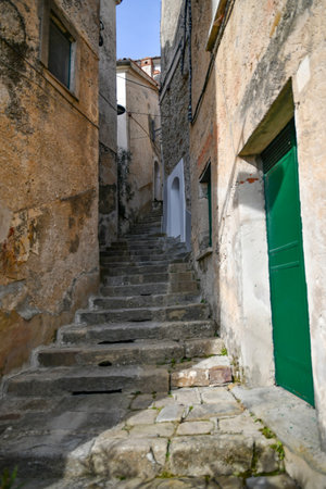 A narrow street among the old stone houses of Castellabate, a medieval town in Salerno province, Italyの写真素材