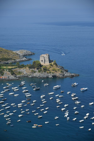 A panoramic shot of boats in the sea in Calabria, Italyの写真素材