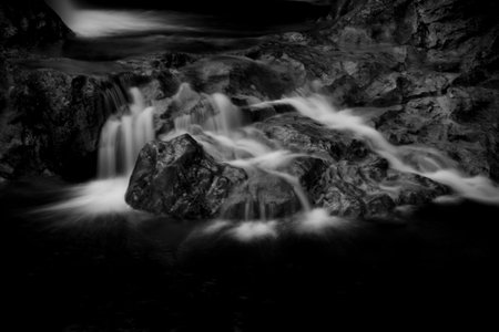 a photo of small river waterfall in grayscaleの写真素材