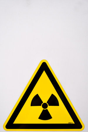 A vertical shot of a nuclear sign on a white backgroundの写真素材