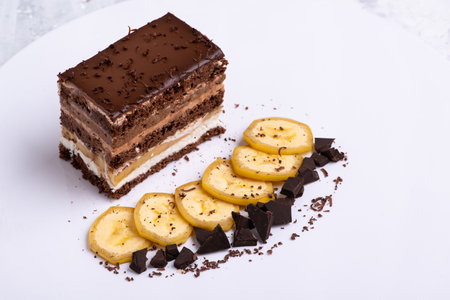 A serving of delicious chocolate cake on a white plateの写真素材