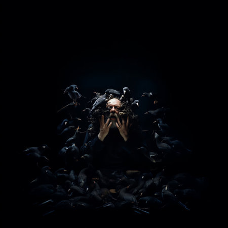 A bearded man with an array of crows perched on his head and shoulders, AI-generated.の素材