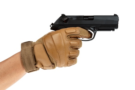Beretta pistol in hand with tan glove