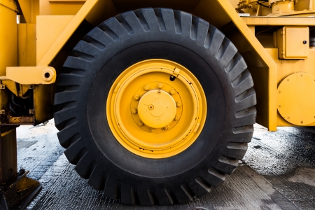 Close up to big tractor tire and wheelの写真素材