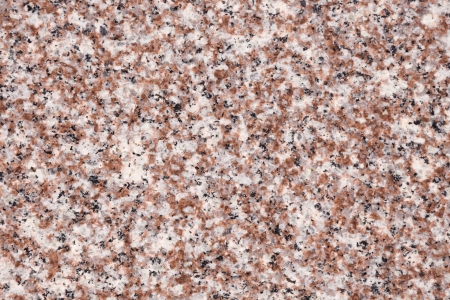 Polished white and pink grain granite as backgroundの写真素材