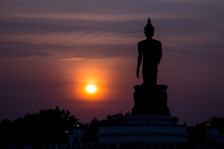 Statue of buddha at sunset silhouetteの写真素材