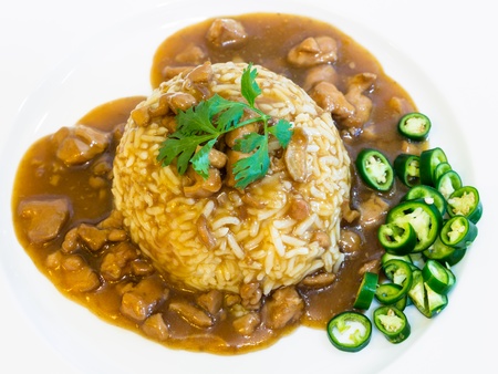 Rice with chinese style chicken in red sauceの写真素材