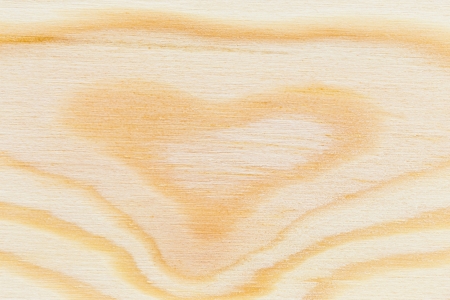 Pine wood texture plank with heart shape gnarlの写真素材